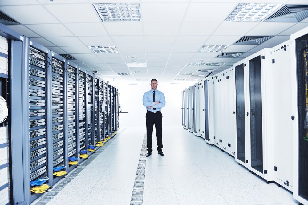 young handsome business man  engeneer in datacenter server room